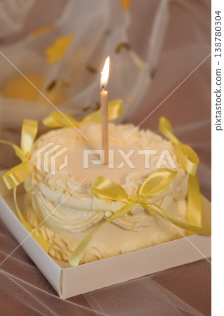 Gourmet Dessert Featuring Candle And Elegant Bows Captured With Delicate Studio Lighting Gourmet Dessert Featuring Candle And Elegant Bows Captured With Delicate Studio Lighting 138780304