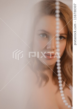 Woman With Jewelry. Intimate Shot Of Lady Showcasing Beauty With Gentle Gaze And Glossy Lips 138780307