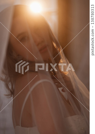 Bride Preparing Peacefully. Calm Bride Adjusting Attire As Morning Light Softly Illuminates Her Bride Preparing Peacefully. Calm Bride Adjusting Attire As Morning Light Softly Illuminates Her 138780313