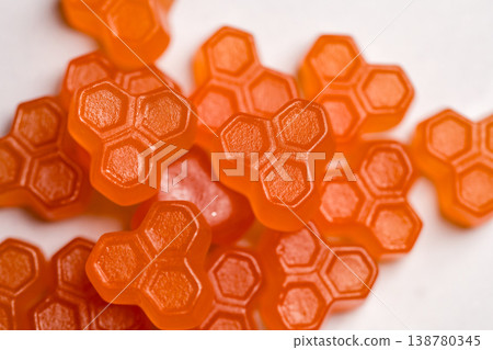 Jelly gummies close-up, fruit vitamins on bright background, food supplements.Orange vitamins candies 138780345