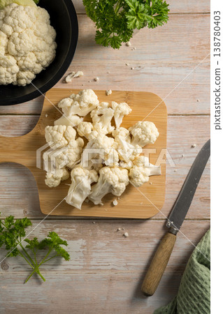 Female hands holding cauliflower lettuce pieces, cooking healthy vegetables 138780403