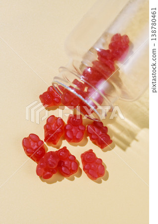Jelly gummy bears in a jar, fruit vitamins on bright background, food supplements.Orange vitamins in a jar, copy space Jelly gummy bears in a jar, fruit vitamins on bright background, food supplements.Orange vitamins in a jar, copy space 138780461