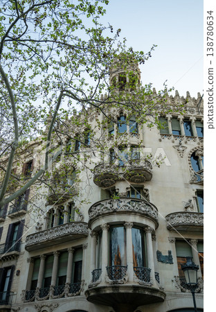 Ornate Art Nouveau building facade with intricate balconies and sculptural details in Barcelona city architecture Ornate Art Nouveau building facade with intricate balconies and sculptural details in Barcelona city architecture 138780634