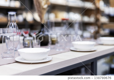 Fashionable and current display showcasing ceramics alongside transparent containers 138780676