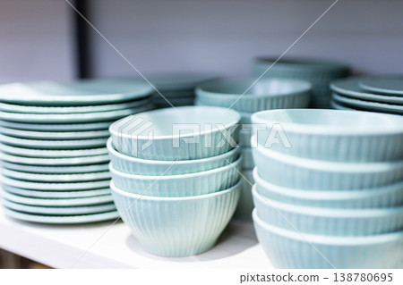 Stylishly arranged pastel ceramic dishware showcasing ribbed glaze and serene mint shades 138780695