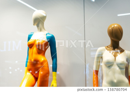 Dynamic storefront showcase emphasizing current artistic dress forms and designs 138780704