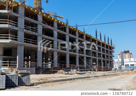 Site supervisor oversees staged assembly of concrete framework with open balcony designs Site supervisor oversees staged assembly of concrete framework with open balcony designs 138780712