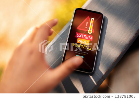 Extreme heat warning, climate change impact, heatwave alert on Mobile phone Extreme heat warning, climate change impact, heatwave alert on Mobile phone 138781003
