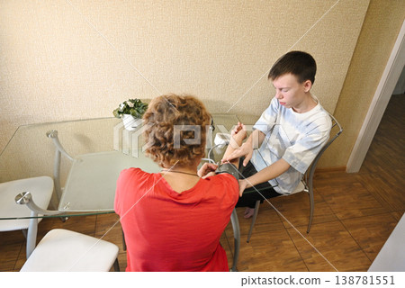 Boy listening to grandfather's heartbeat with stethoscope Boy listening to grandfather's heartbeat with stethoscope 138781551