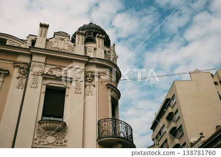 Elegant historic building facade with rich ornamental details and balcony in Belgrade. Concept of classic architecture, urban lifestyle and real estate value Elegant historic building facade with rich ornamental details and balcony in Belgrade. Concept of classic architecture, urban lifestyle and real estate value 138781760