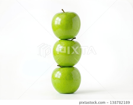 Geometric Stack of Three Different Green Apples with Stems Isolated on a Solid White Background 138782189