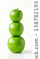 Geometric Stack of Three Different Green Apples with Stems Isolated on a Solid White Background 138782193