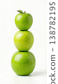 Geometric Stack of Three Different Green Apples with Stems Isolated on a Solid White Background 138782195