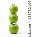 Geometric Stack of Three Different Green Apples with Stems Isolated on a Solid White Background 138782196