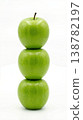 Geometric Stack of Three Different Green Apples with Stems Isolated on a Solid White Background 138782197
