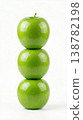 Geometric Stack of Three Different Green Apples with Stems Isolated on a Solid White Background 138782198