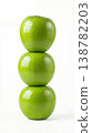 Geometric Stack of Three Different Green Apples with Stems Isolated on a Solid White Background 138782203