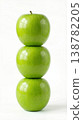 Geometric Stack of Three Different Green Apples with Stems Isolated on a Solid White Background 138782205