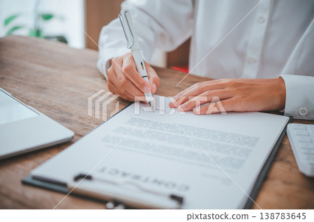businessman is negotiating, advising, and explaining the matter of the contract to be agreed to sign the contract. 138783645