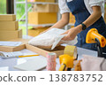 Online small business owners are packing their ordered products that customers order online into a box .concept of online shopping 138783752