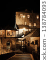 Night view of historic stone buildings in Mostar illuminated by warm lights. Traditional Balkan architecture and quiet atmosphere emphasize the timeless character of the old town 138784093