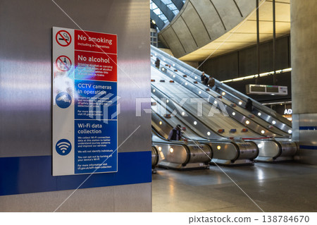 Rules sign by escalators in a modern subway station Rules sign by escalators in a modern subway station 138784670