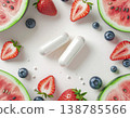 Gut health food, Summer. Fresh strawberries, blueberries, and watermelon slices surround two white capsules on white background 138785566