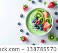 Gut health food, Summer. vibrant bowl of green smoothie topped with fresh kiwi, strawberries, blueberries, and chia seeds 138785570