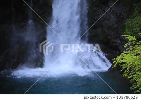 A waterfall cascading down a valley – a refreshing natural scene of Japan. 138786629