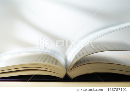 Opening a book (image) Opening a book (image) 138787101