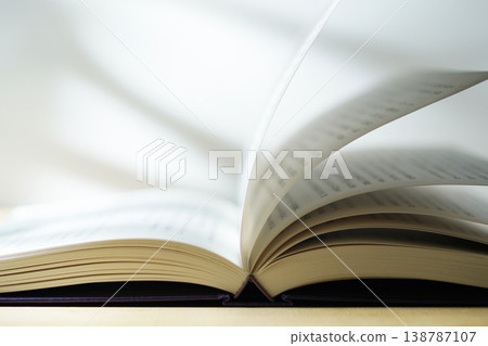Opening a book (image) Opening a book (image) 138787107