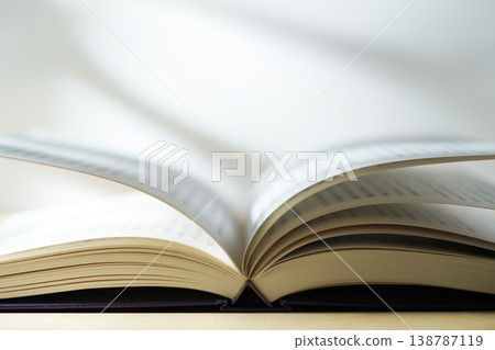 Opening a book (image) Opening a book (image) 138787119