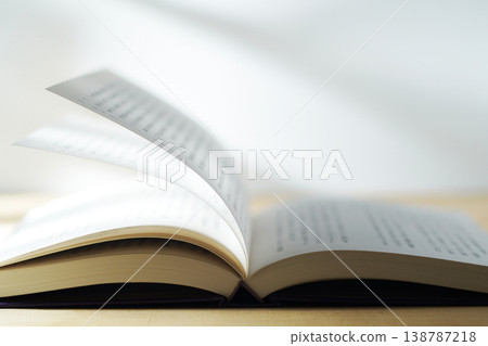 Opening a book (image) Opening a book (image) 138787218