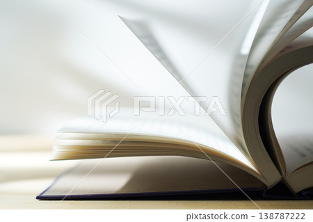 Opening a book (image) Opening a book (image) 138787222