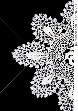 Close up of vintage lace fabric white on black background embroidery 138787241