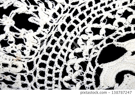 Close up of vintage lace fabric white on black background embroidery Close up of vintage lace fabric white on black background embroidery 138787247