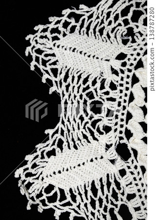 Close up of vintage lace fabric white on black background embroidery Close up of vintage lace fabric white on black background embroidery 138787280