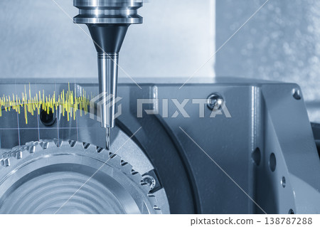 Abstract 5-axis CNC milling machine cutting precision gear parts with digital vibration graph indicator overlay. Abstract 5-axis CNC milling machine cutting precision gear parts with digital vibration graph indicator overlay. 138787288