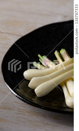 Shallots served on a black plate Shallots served on a black plate 138787333