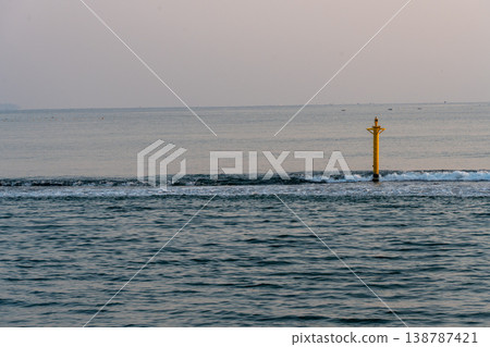 A lighthouse floating on the sea at sunrise 138787421