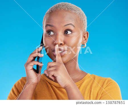 Phone call, secret or finger on lips of black woman in studio for mystery, gossip or conversation. Privacy, news or whisper with girl or shush gesture on blue background for rumor, drama or silence Phone call, secret or finger on lips of black woman in studio for mystery, gossip or conversation. Privacy, news or whisper with girl or shush gesture on blue background for rumor, drama or silence 138787651
