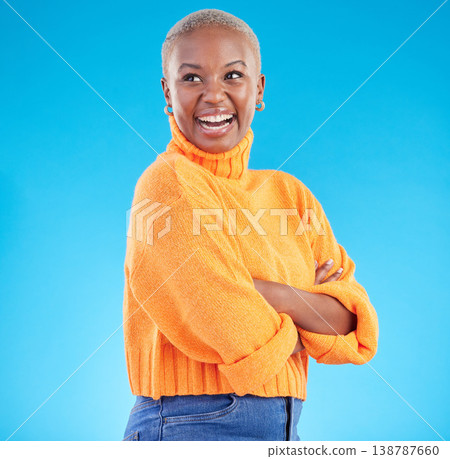 Happy, African woman and fashion with studio, blue background natural beauty or confidence in casual style or clothes. Face, smile and person with happiness in winter clothing or college student Happy, African woman and fashion with studio, blue background natural beauty or confidence in casual style or clothes. Face, smile and person with happiness in winter clothing or college student 138787660