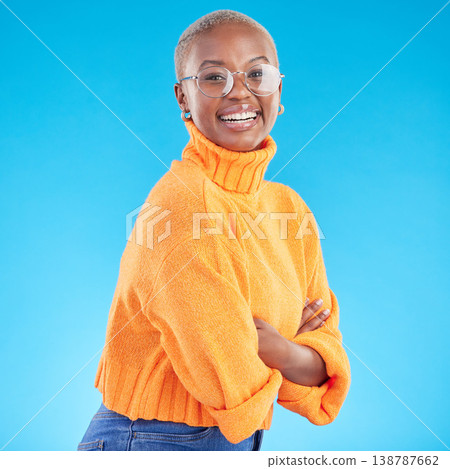 Portrait, happy and black woman with glasses, arms crossed and studio isolated on a blue background. Face, confident nerd and smile for fashion, style and person from South Africa in casual clothes Portrait, happy and black woman with glasses, arms crossed and studio isolated on a blue background. Face, confident nerd and smile for fashion, style and person from South Africa in casual clothes 138787662