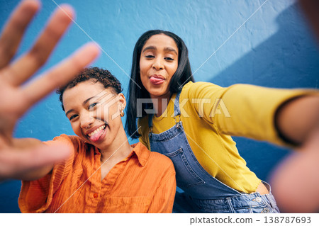 Comic selfie, portrait and women in city on blue background for social media, post and profile picture. Friendship, smile and female people with hand take photo for bonding, quality time and relax 138787693