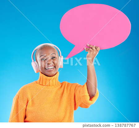 Speech bubble, headphones or portrait of black woman in studio or communication with mockup space. Talking, smile or happy girl on social media for music review, feedback or board on blue background 138787767