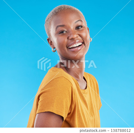 Portrait, fashion and funny black woman in studio isolated on a blue background. Face, happy and young African person, model or girl from Kenya laughing with style in casual clothes and tshirt mockup 138788012