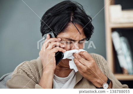 Phone call, sick and woman blowing her nose for the flu, cold or sinus allergies at her home. Illness, telehealth and senior female person with tissue on a medical doctor consultation with cellphone. 138788055