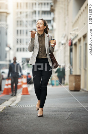 Speaker phone call, city street or business woman walking, consulting or talking with contact, user or person. Cellphone voice app, speech to text and agent chat on morning commute, trip or journey Speaker phone call, city street or business woman walking, consulting or talking with contact, user or person. Cellphone voice app, speech to text and agent chat on morning commute, trip or journey 138788079