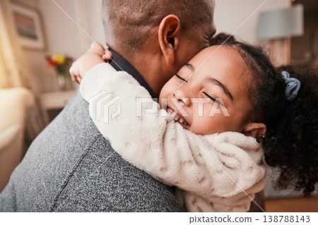 Father, child and hug in home living room for love, care and bonding together. Dad, girl and embrace in lounge for trust, support and quality family time to relax, smile and happy kid in house 138788143