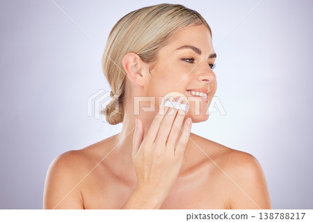 Beauty, studio face or happy woman with cotton pad for facial cleaning routine, foundation skincare treatment or cosmetology. Cosmetic, swab or person with makeup removal product on purple background 138788217